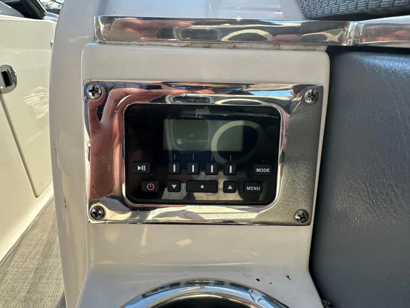 Slide: The Image of Polk audio control panel on 2016 Chaparral 337SSX boat dashboard. - 37