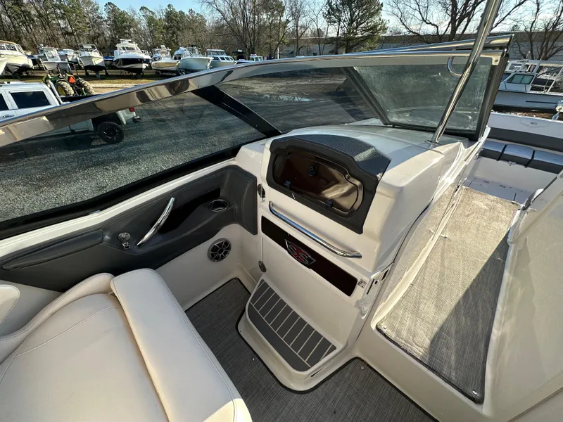 Slide: The Image of 2016 Chaparral 337SSX boat interior with seating and dashboard view. - 38