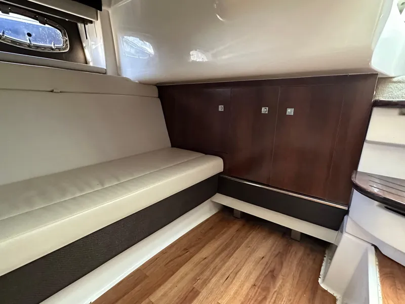 Slide: The Image of Interior of 2016 Chaparral 337SSX boat with seating and wooden cabinetry. - 45