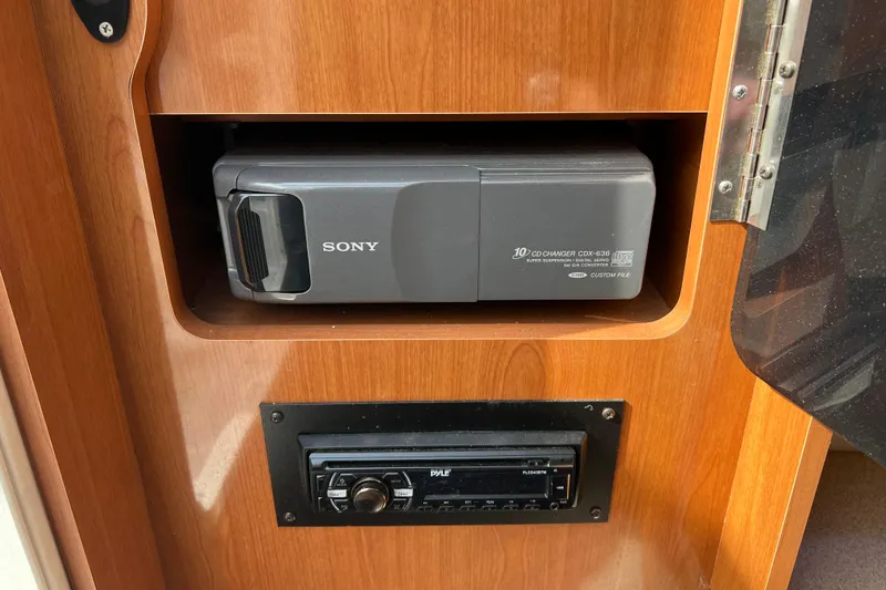Slide: The Image of Sony CD changer and Pyle stereo in 2001 Four Winns 268 Vista boat interior. - 14