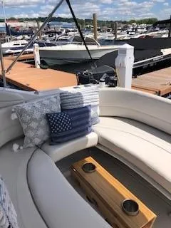 The Image of 2001 Four Winns 268 Vista boat on display under a clear blue sky. - 2