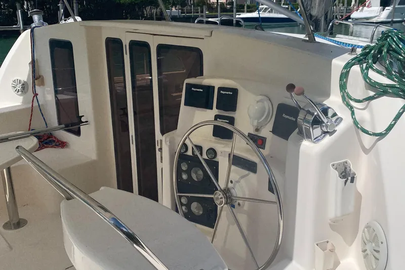 Slide: The Image of Helm of 2003 Leopard 38 catamaran with steering wheel and navigation instruments. - 17
