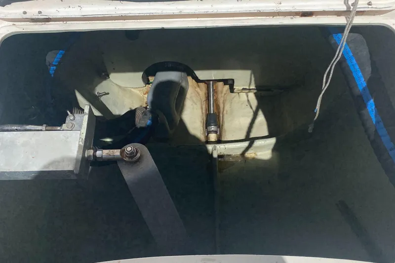 Slide: The Image of Engine compartment of a 2003 Leopard 38 catamaran, showing mechanical components and wiring. - 18