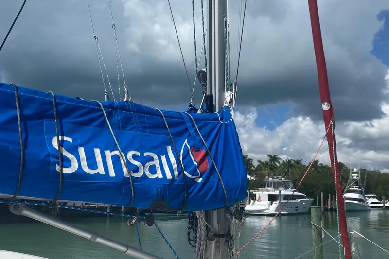 Slide: The Image of Sailboat with Sunsail branding docked, Leopard 38 model, 2003, under cloudy sky. - 21