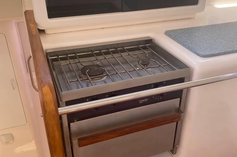 Slide: The Image of Compact kitchen stove in a 2003 Leopard 38 yacht galley. - 35