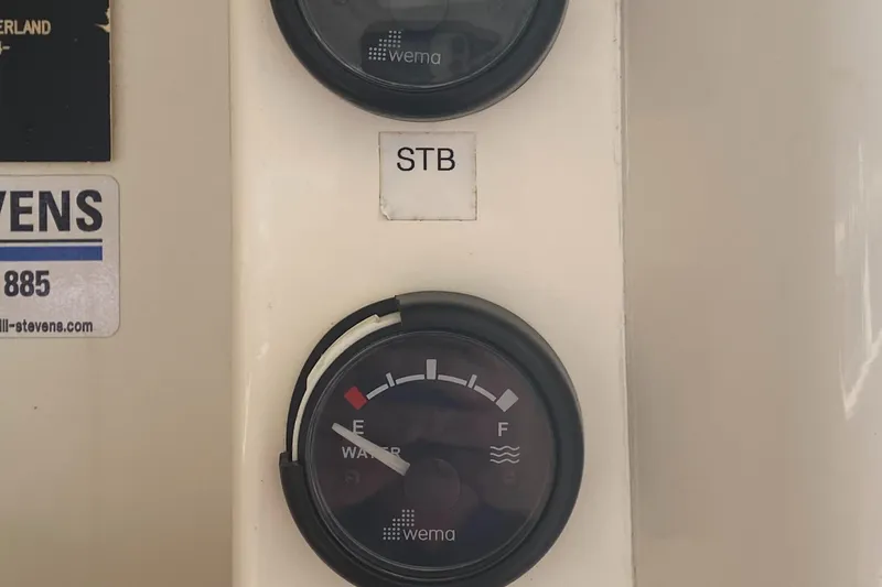 Slide: The Image of Fuel gauge panel on a 2003 Leopard 38 boat, showing "STB" and "Wema" branding. - 40
