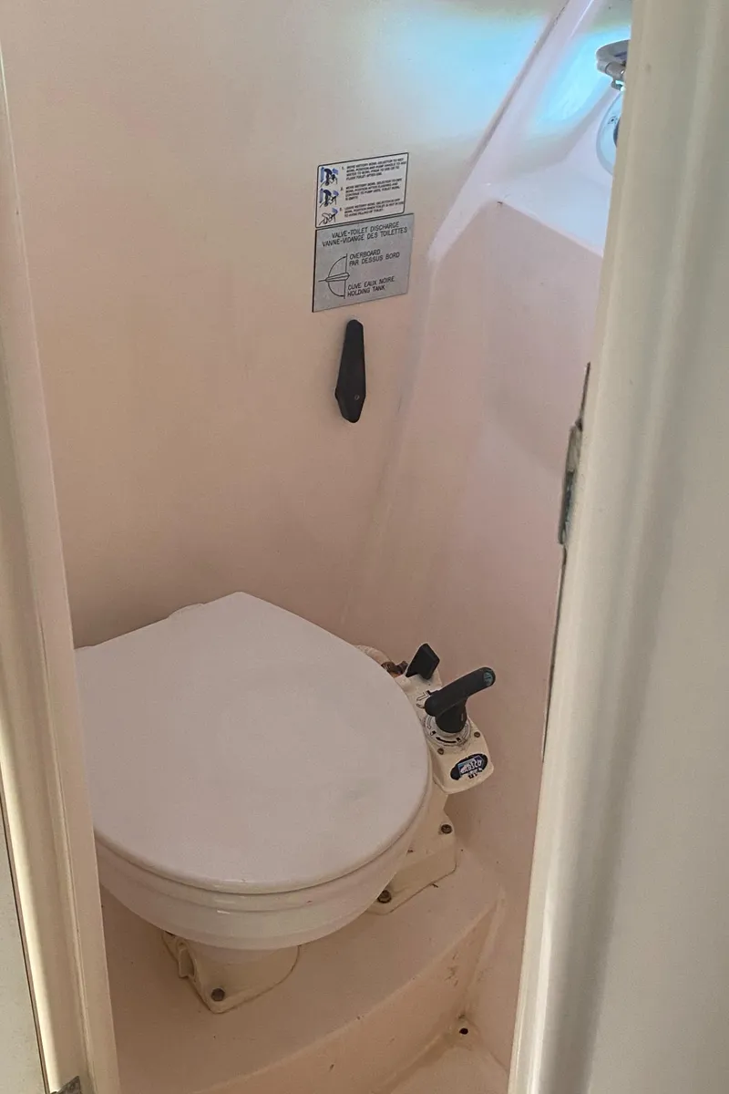 Slide: The Image of 2003 Leopard 38 boat bathroom with compact marine toilet. - 47