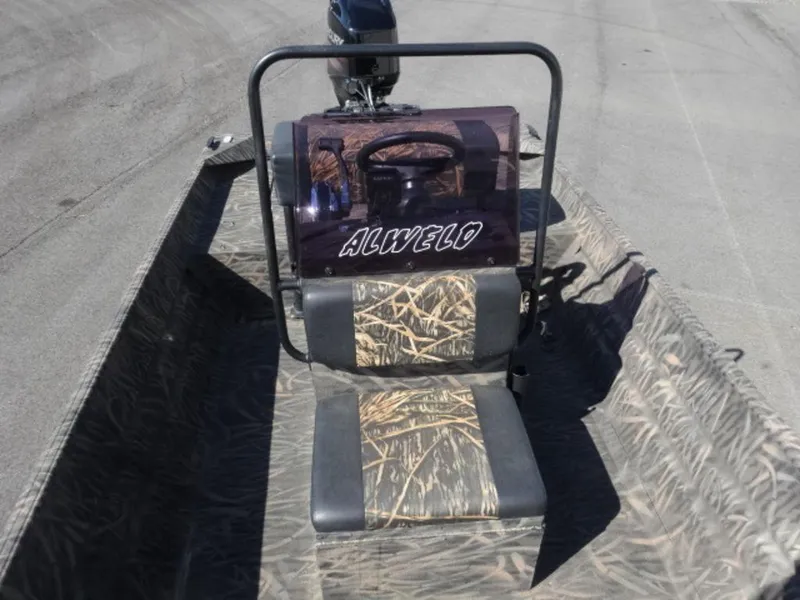 Slide: The Image of 2020 Alweld 1752 Marsh Console boat with camouflage seating and steering console. - 11