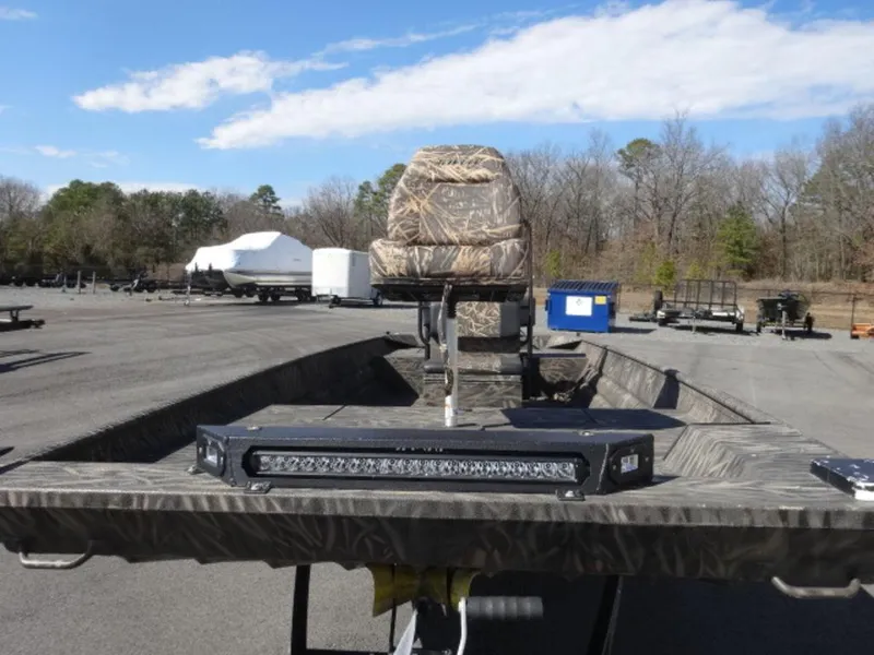 Slide: The Image of 2020 Alweld 1752 Marsh Console boat with camo seat and LED light bar. - 3