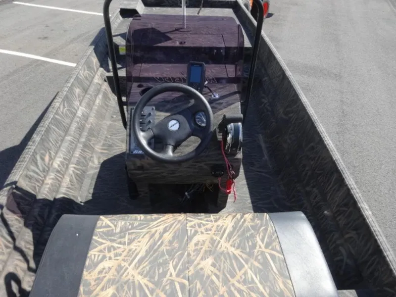 Slide: The Image of 2020 Alweld 1752 Marsh Console boat interior with steering wheel and camouflage design. - 7