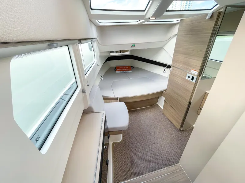 Slide: The Image of Interior of 2024 Saxdor 320 GTO boat, featuring modern design and comfortable seating. - 11