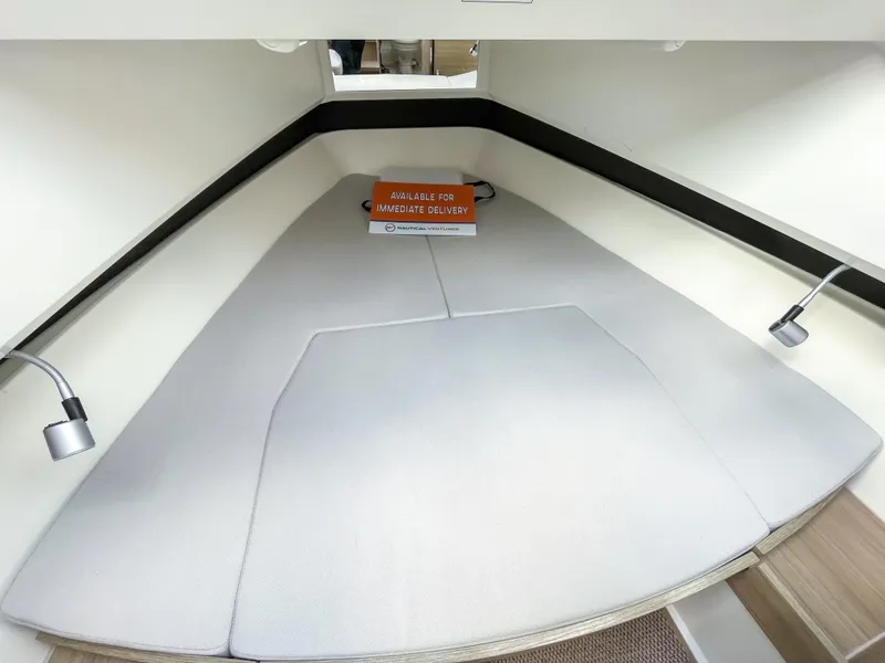 Slide: The Image of 2024 Saxdor 320 GTO cabin interior with modern lighting and comfortable bedding. - 13