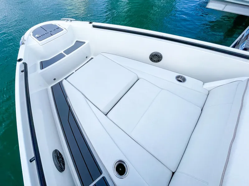 Slide: The Image of 2024 Saxdor 320 GTO boat deck with white seating and sleek design. - 2