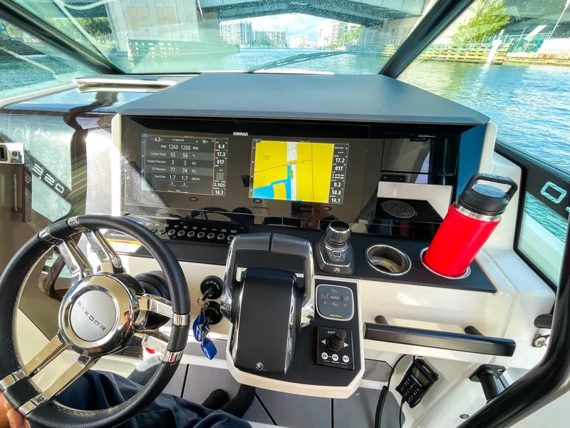 Slide: The Image of 2024 Saxdor 320 GTO helm with navigation display and steering wheel. - 5