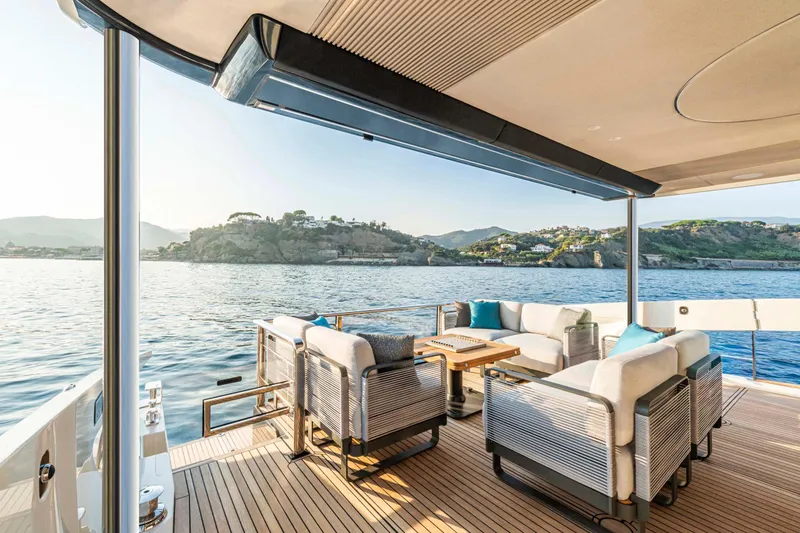 Slide: The Image of Luxurious deck of Absolute 70 N yacht, 2026 model, with scenic ocean view. - 13