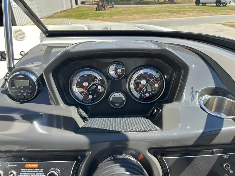 Slide: The Image of Dashboard of a 2017 Bayliner VR5 boat with gauges and controls. - 5