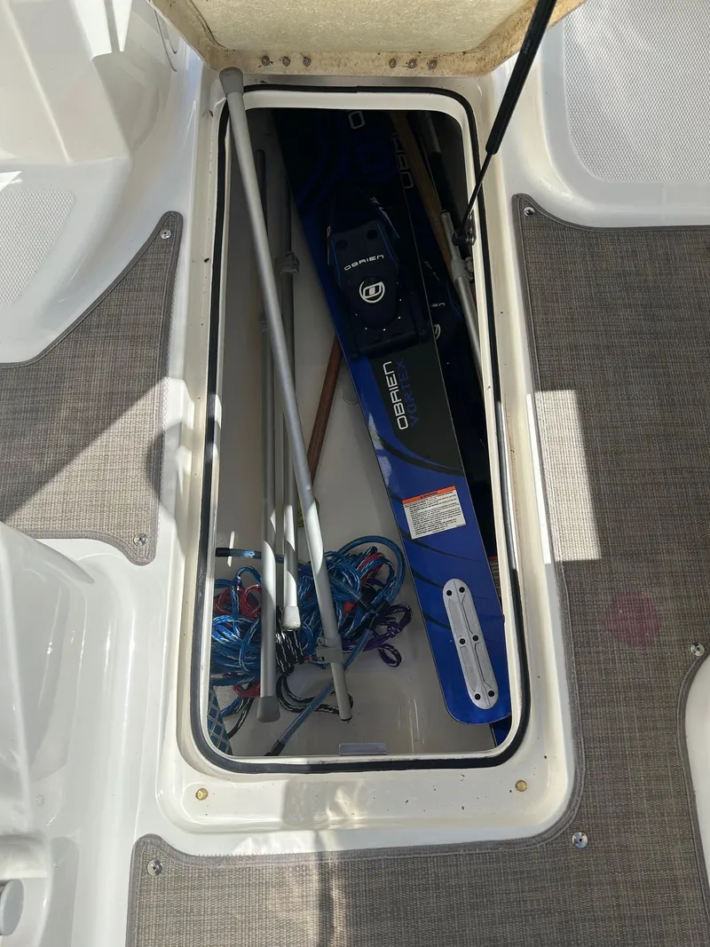 Slide: The Image of Storage compartment in 2017 Bayliner VR5 boat with water ski and equipment. - 9