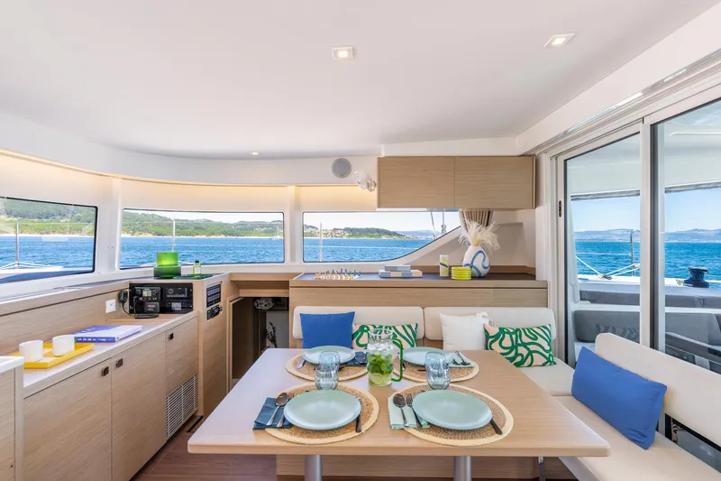 Slide: The Image of Modern interior of 2025 Lagoon 43 yacht with dining area and ocean view. - 20