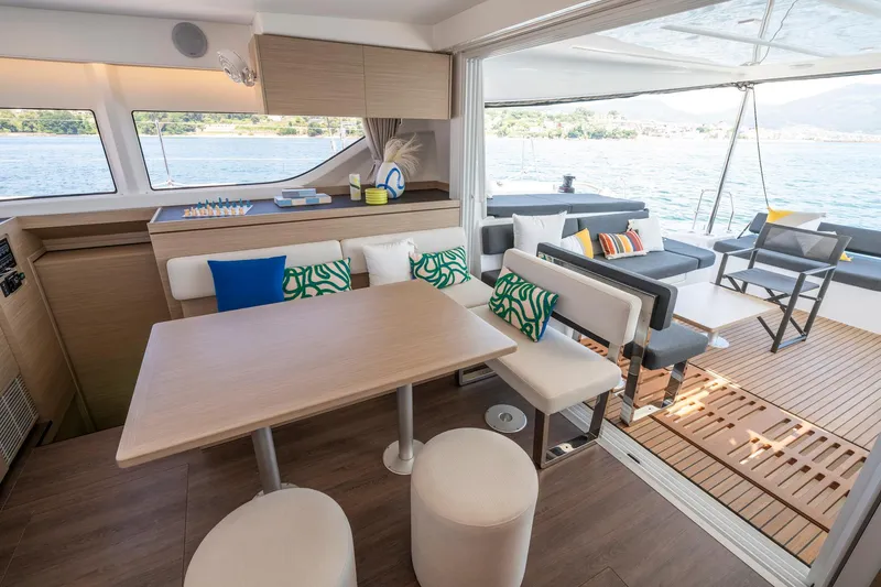 Slide: The Image of Luxurious interior of 2025 Lagoon 43 catamaran with modern seating and scenic ocean view. - 35