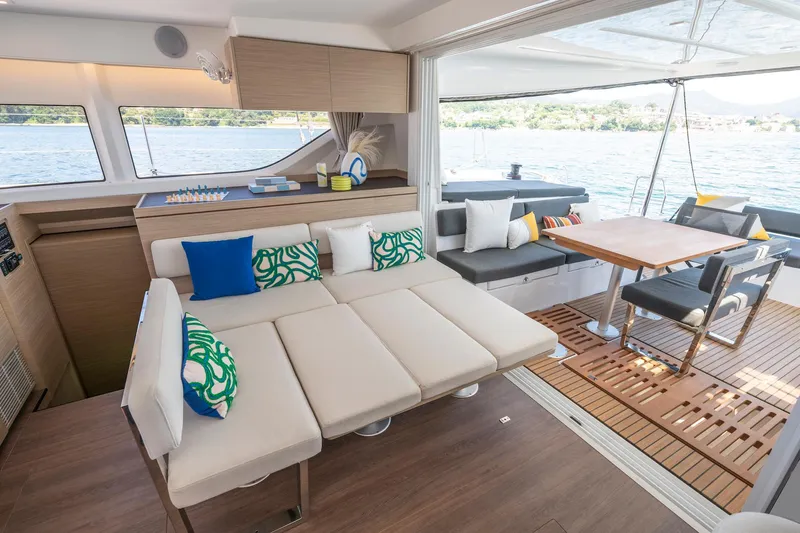 Slide: The Image of Luxurious interior of 2025 Lagoon 43 yacht with modern seating and dining area. - 37