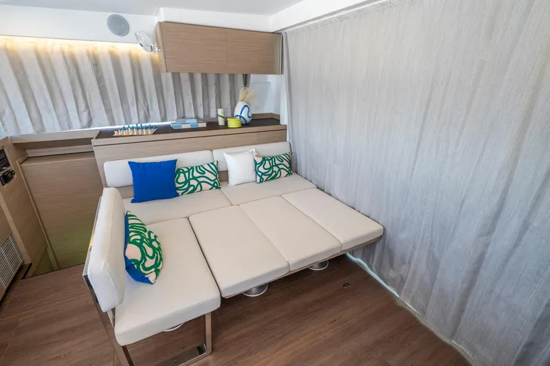 Slide: The Image of Interior of 2025 Lagoon 43 yacht with modern seating and colorful cushions. - 38