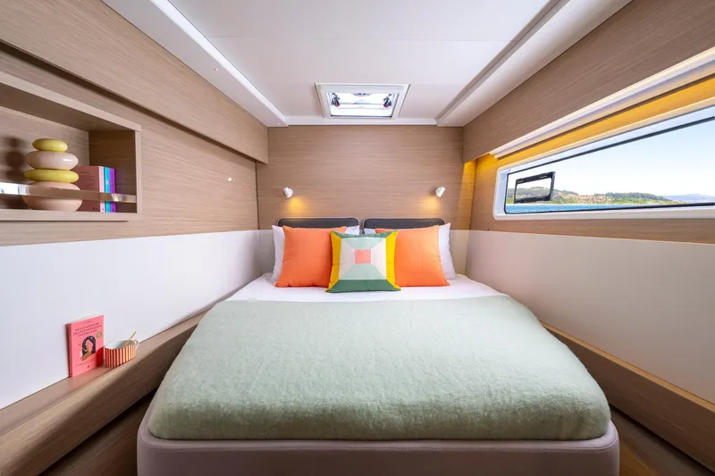 Slide: The Image of Luxurious bedroom interior of 2025 Lagoon 43 yacht with modern decor and large window view. - 41