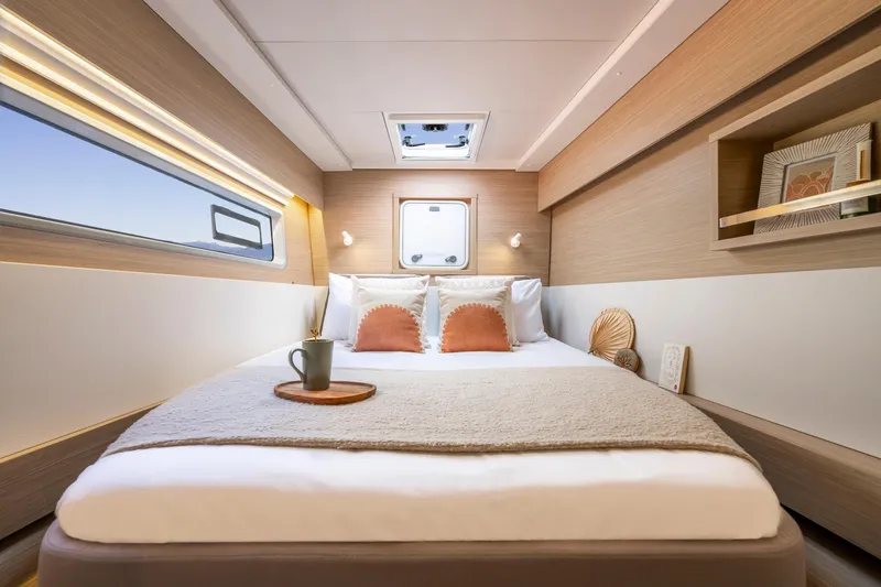 Slide: The Image of Luxurious cabin interior of 2025 Lagoon 43 yacht with cozy bed and modern decor. - 42
