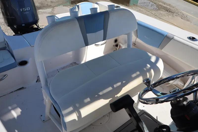 Slide: The Image of 2023 Robalo R200 Center Console boat interior with seating and steering wheel. - 10