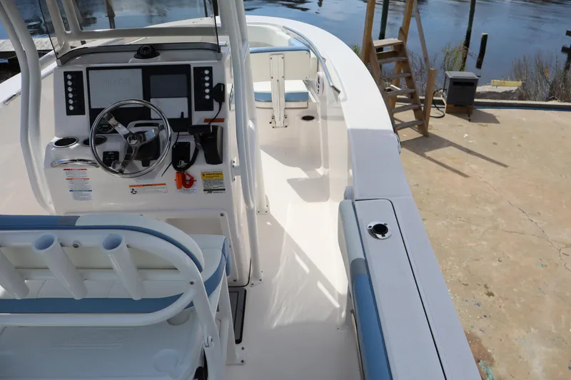 Slide: The Image of 2023 Robalo R200 Center Console boat interior with steering wheel and seating. - 14