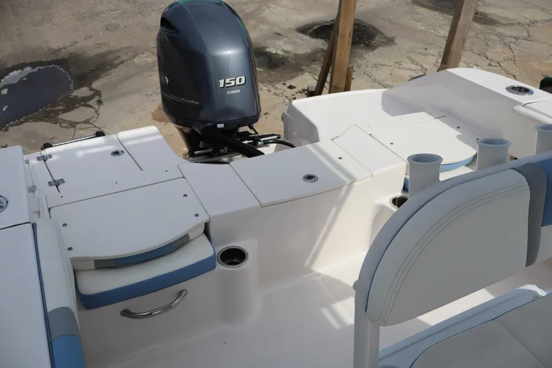 Slide: The Image of 2023 Robalo R200 Center Console boat with Yamaha 150 engine, featuring spacious seating and storage. - 17