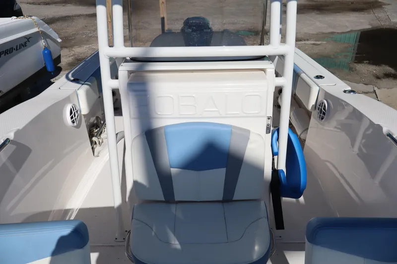 Slide: The Image of 2023 Robalo R200 Center Console boat interior with blue and white seating. - 7
