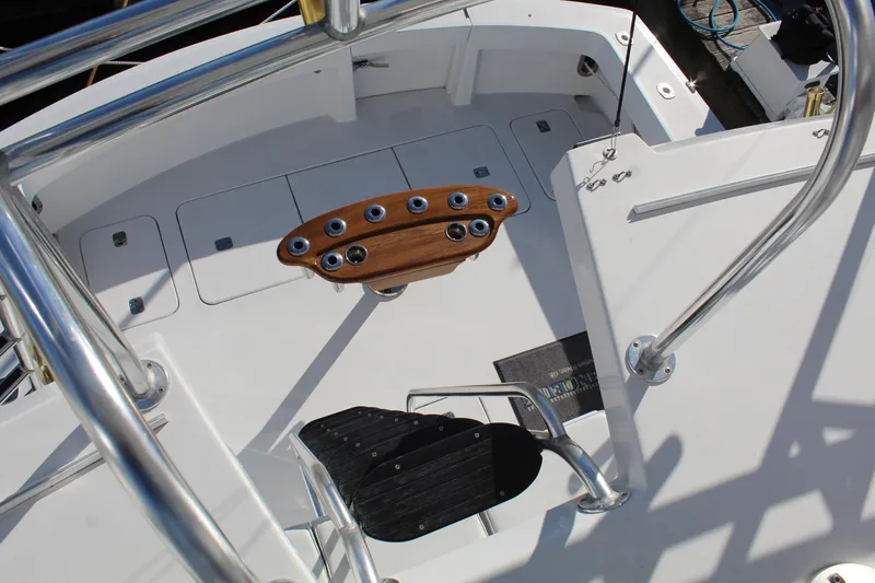 Slide: The Image of Hatteras 50' Convertible 2005 yacht deck with fishing rod holders and stainless steel railings. - 31