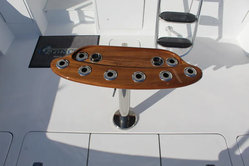 Slide: The Image of Fishing rod holder on 2005 Hatteras 50' Convertible yacht deck. - 32