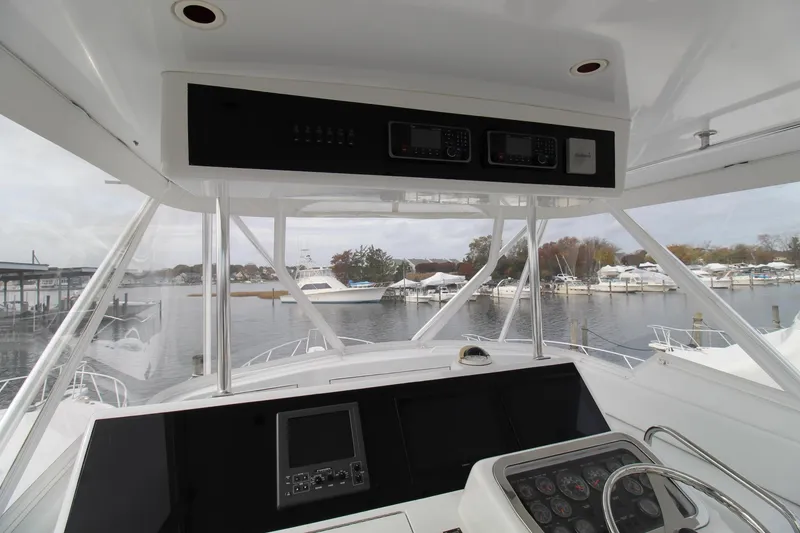Slide: The Image of Interior view of 2005 Hatteras 50' Convertible yacht cockpit with navigation equipment. - 46