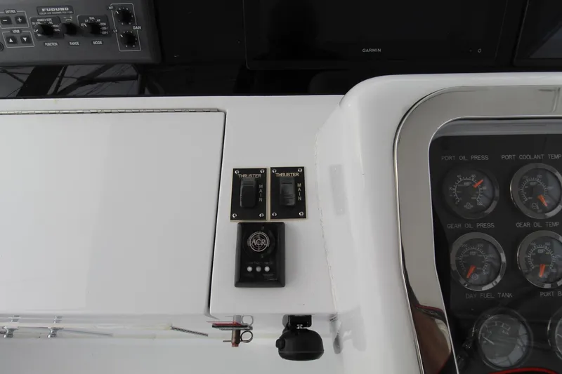 Slide: The Image of Control panel of a 2005 Hatteras 50' Convertible yacht with gauges and switches. - 47