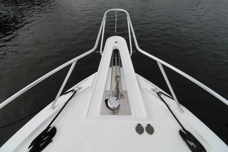 Slide: The Image of Bow of 2005 Hatteras 50' Convertible yacht with anchor and railing. - 6
