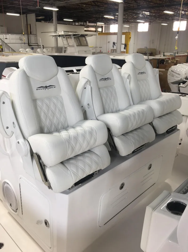 Slide: The Image of Luxurious white seating on 2020 Invincible 40 Catamaran, showcasing premium comfort and design. - 11