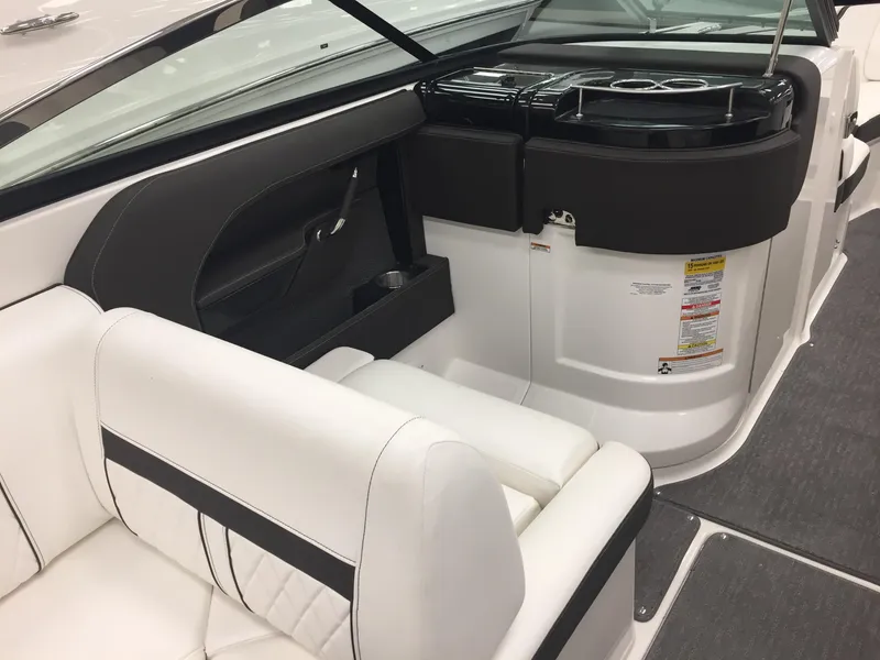 Slide: The Image of 2018 Sea Ray SLX 250 boat interior with white seating and sleek design. - 10