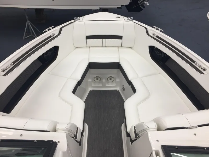 Slide: The Image of 2018 Sea Ray SLX 250 boat interior with white seating and sleek design. - 11