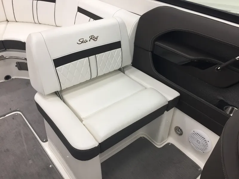 Slide: The Image of 2018 Sea Ray SLX 250 boat interior with white and black seating. - 13