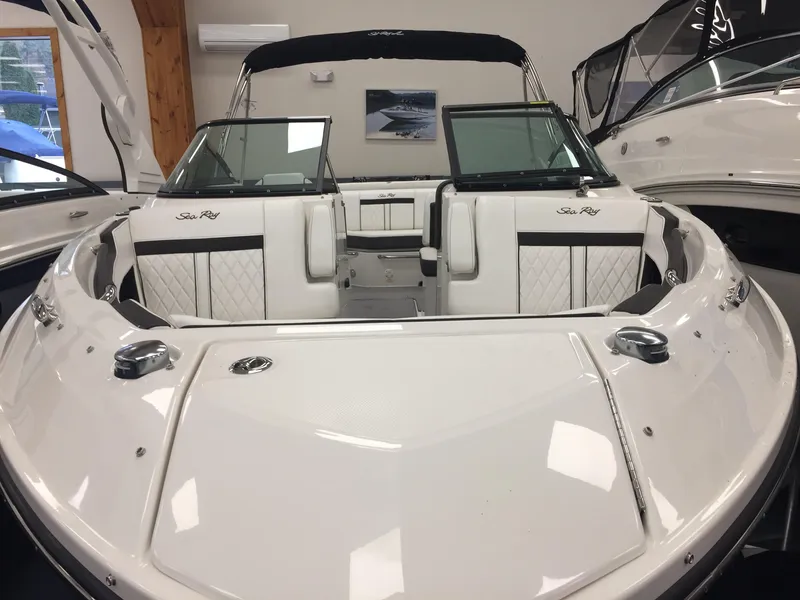 Slide: The Image of 2018 Sea Ray SLX 250 boat interior with white seating and sleek design. - 3