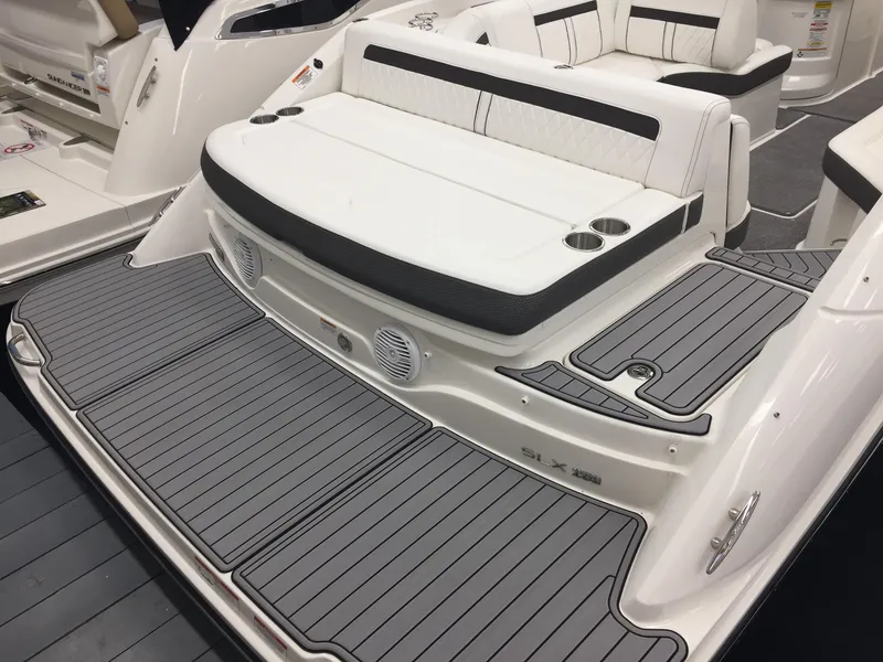 Slide: The Image of 2018 Sea Ray SLX 250 boat with spacious seating and sleek design. - 5