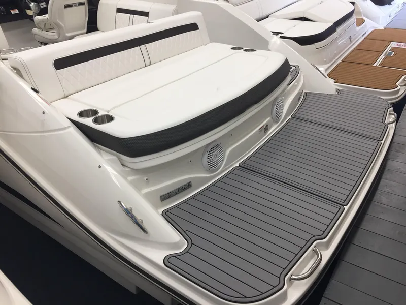 Slide: The Image of 2018 Sea Ray SLX 250 boat with spacious rear deck and seating area. - 6