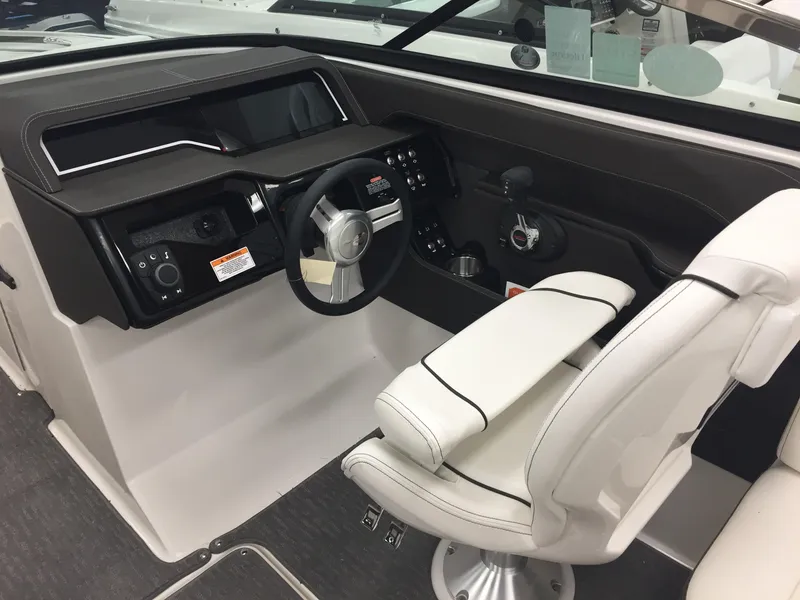 Slide: The Image of Interior cockpit of 2018 Sea Ray SLX 250 boat with steering wheel and controls. - 8