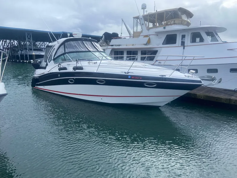 The Image of 2018 Four Winns V355 boat docked in marina, surrounded by other vessels. - 0