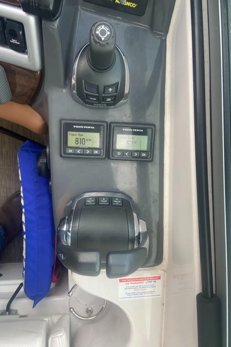 Slide: The Image of Control panel of a 2018 Four Winns V355 boat with digital displays and joystick. - 13