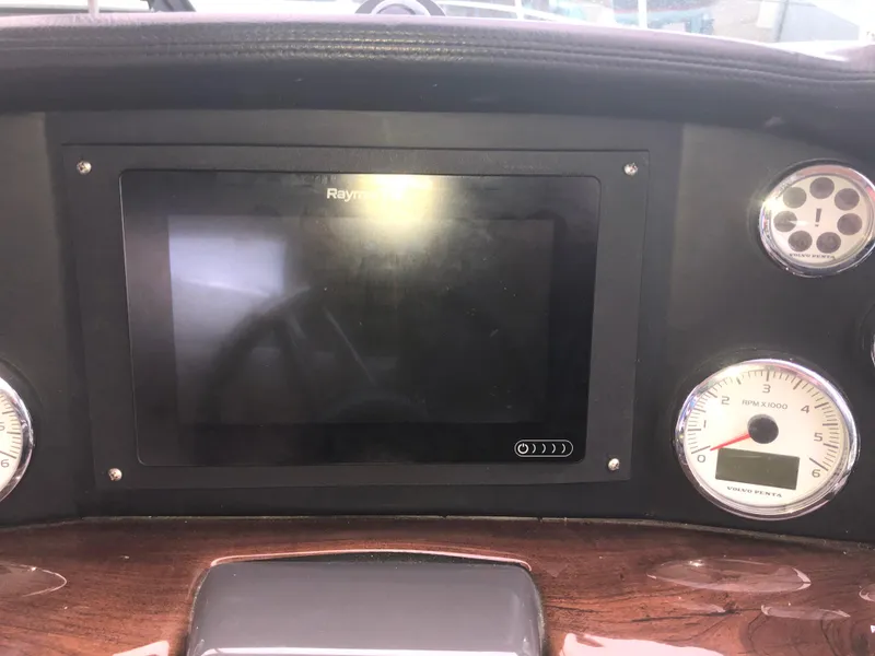 Slide: The Image of Dashboard of 2018 Four Winns V355 boat with Raymarine display and gauges. - 14