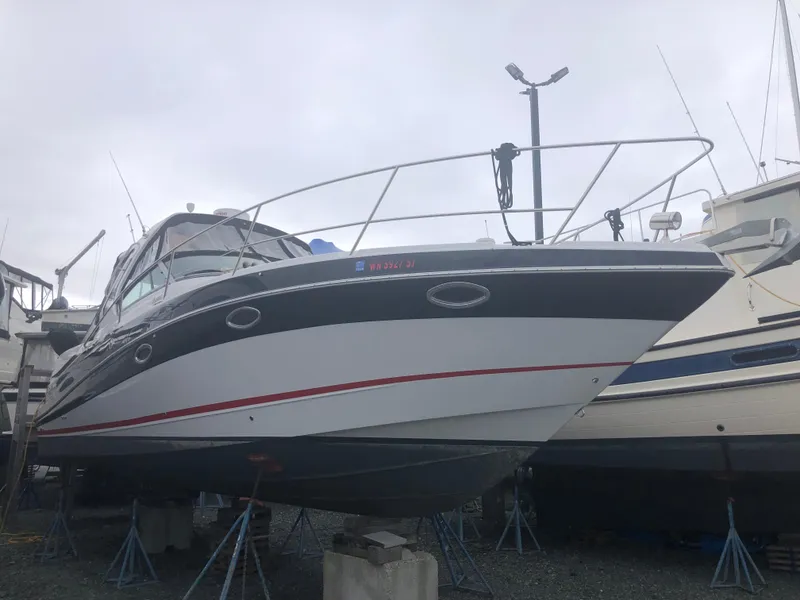Slide: The Image of 2018 Four Winns V355 boat on stands, overcast sky background. - 3