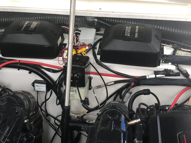 Slide: The Image of Engine compartment of a 2018 Four Winns V355 boat, featuring Volvo Penta components. - 34