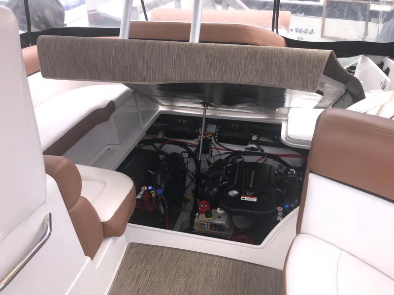 Slide: The Image of 2018 Four Winns V355 boat engine compartment with seating area. - 39